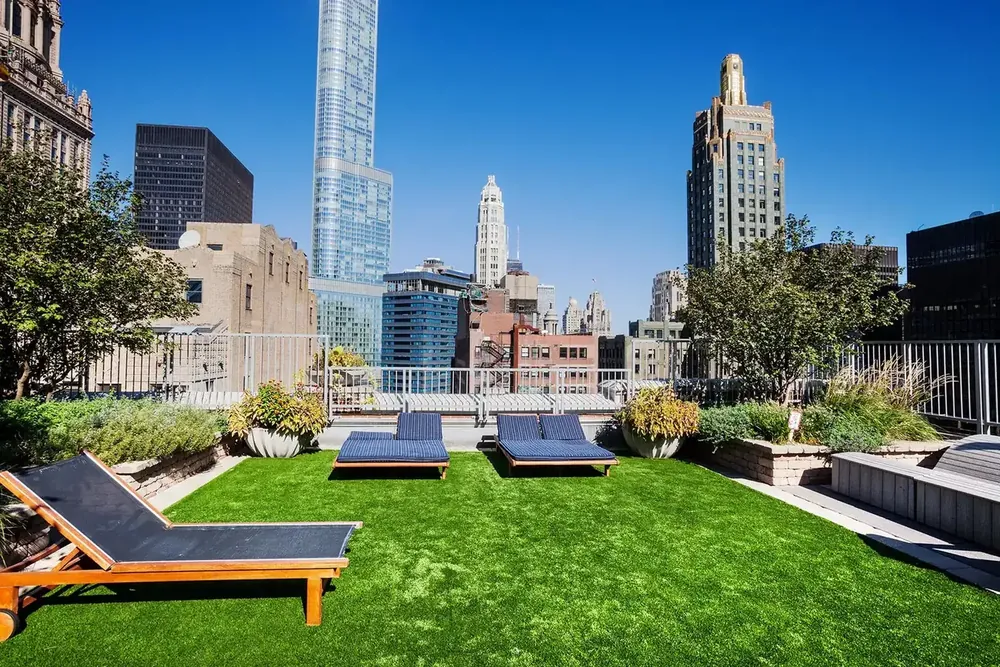 Rooftop balcony artificial turf lounge kept clean by TurFresh