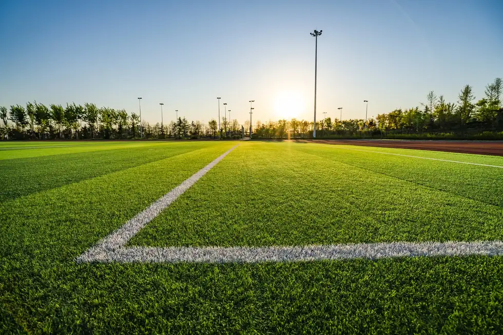 Full-size artificial turf sports field maintained under a TurfAid commercial turf cleaning program