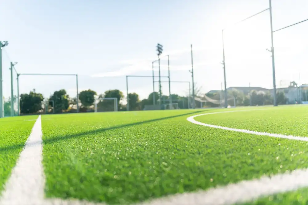 Freshly cleaned artificial turf sports field with crisp white lines after TurfAid commercial turf cleaning by TurFresh