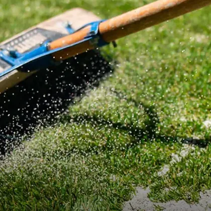 TurFill infill being brushed into artificial turf
