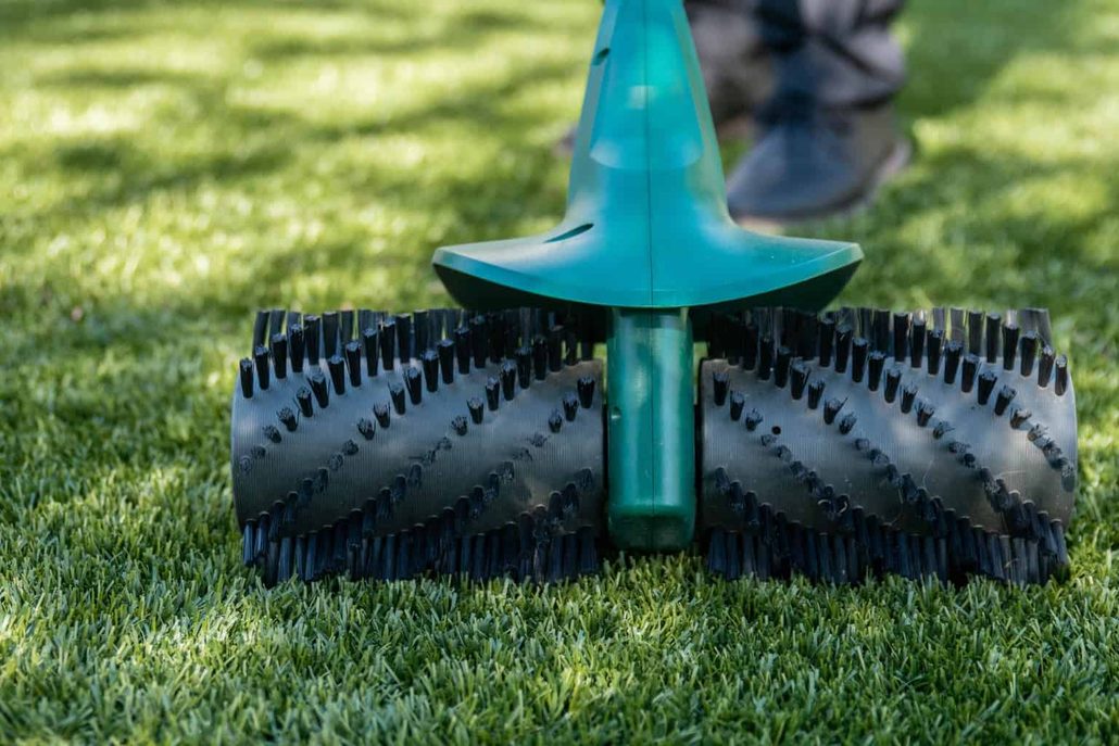 Artificial turf lawn showing clean surface and proper drainage after TurFresh professional turf cleaning service.