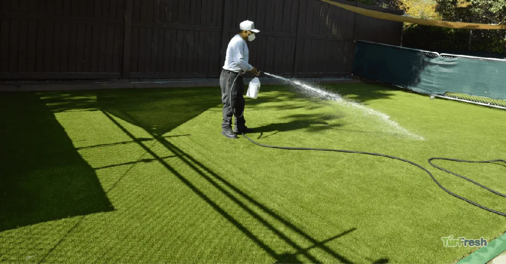 Outdoor surface and artificial turf being deep cleaned